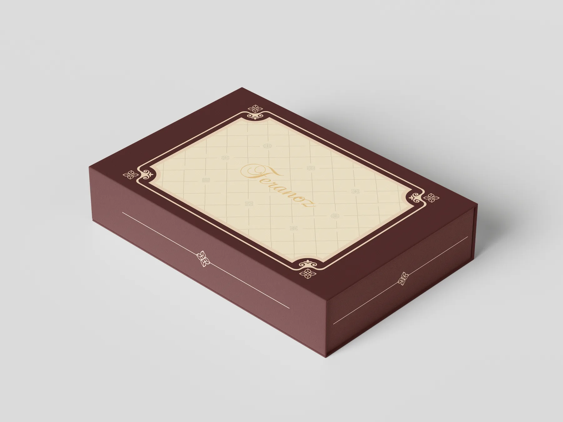 A burgundy brownie gift box with a cream lattice lid and the gold Feranoz logo