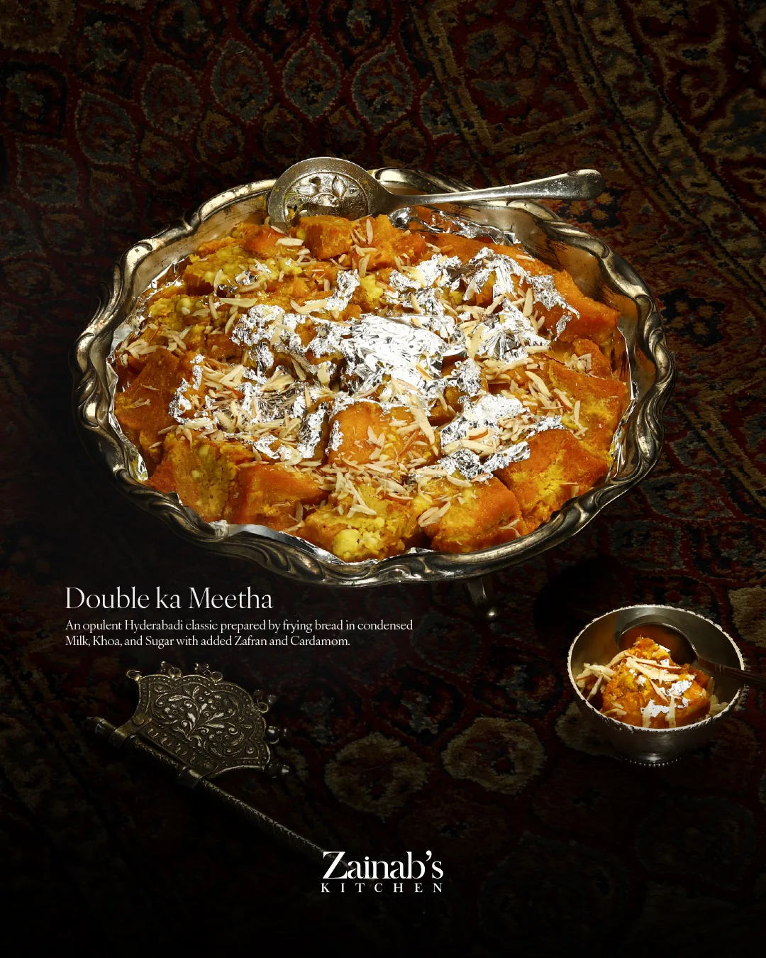 Double ka Meetha in an ornate silver dish on a dark rug